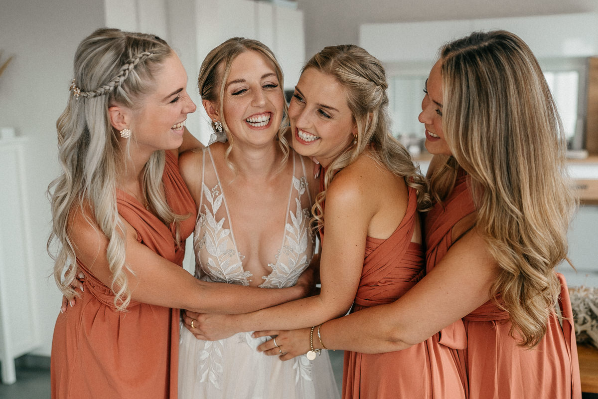 a group of women in dresses