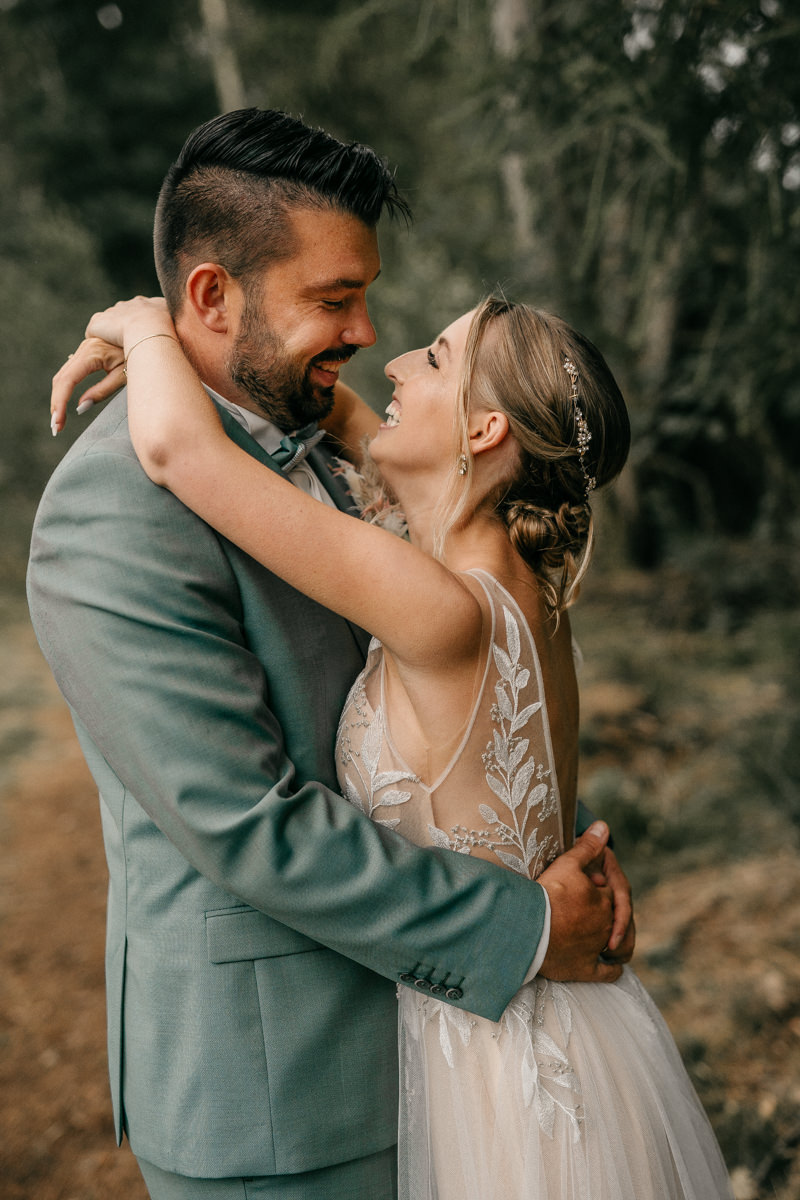 a man and woman hugging each other