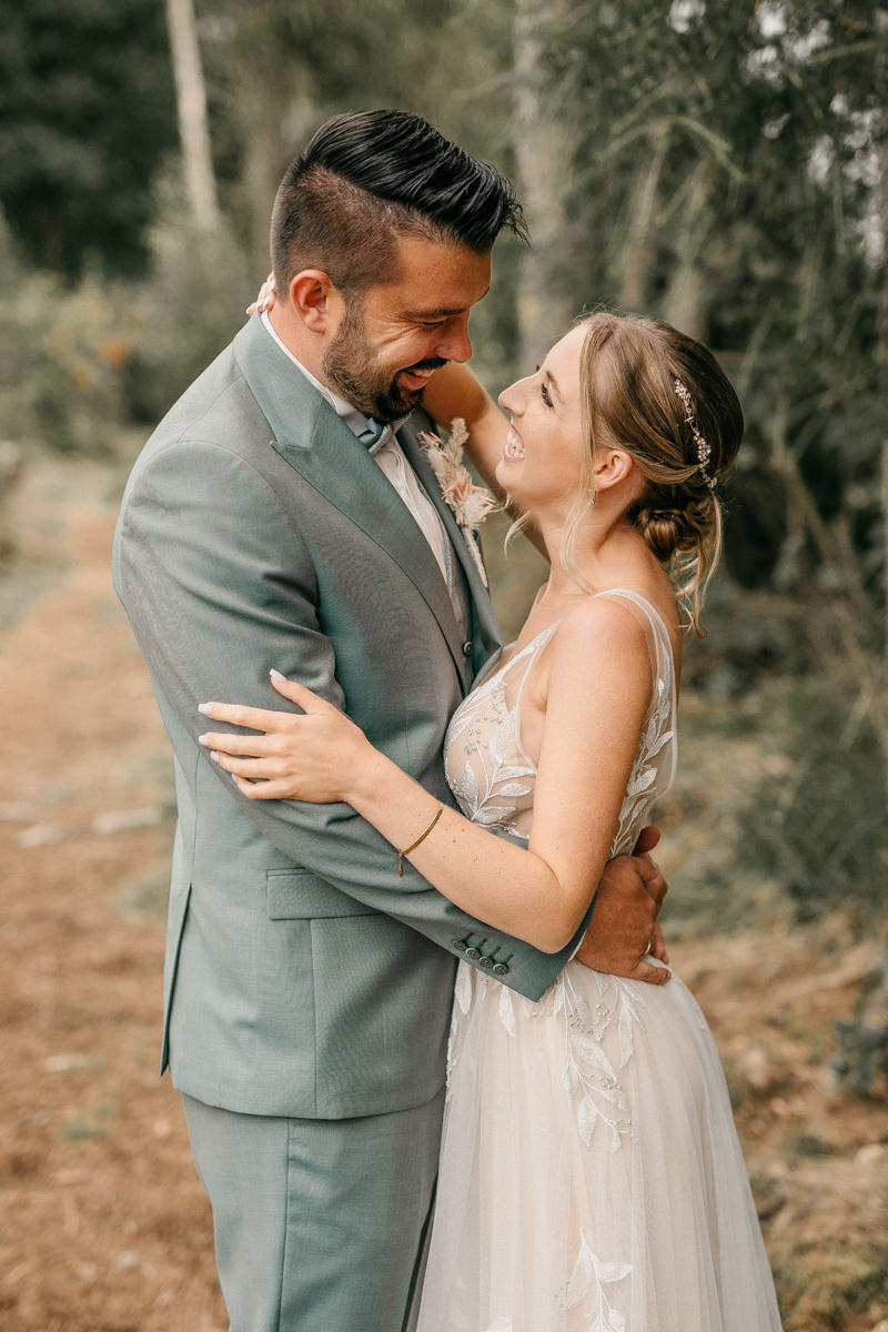 a man and woman hugging each other