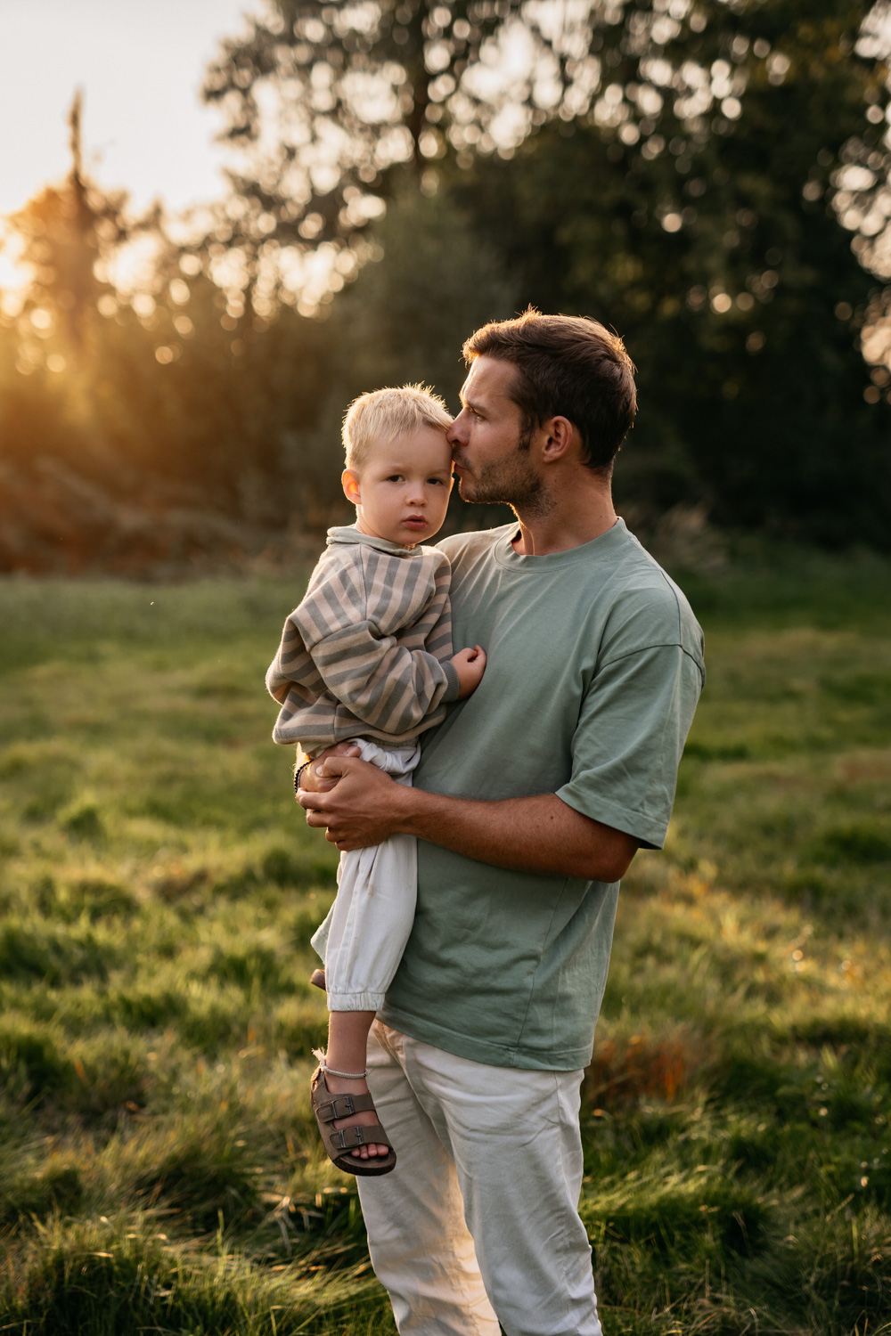 a man holding a child in his arms