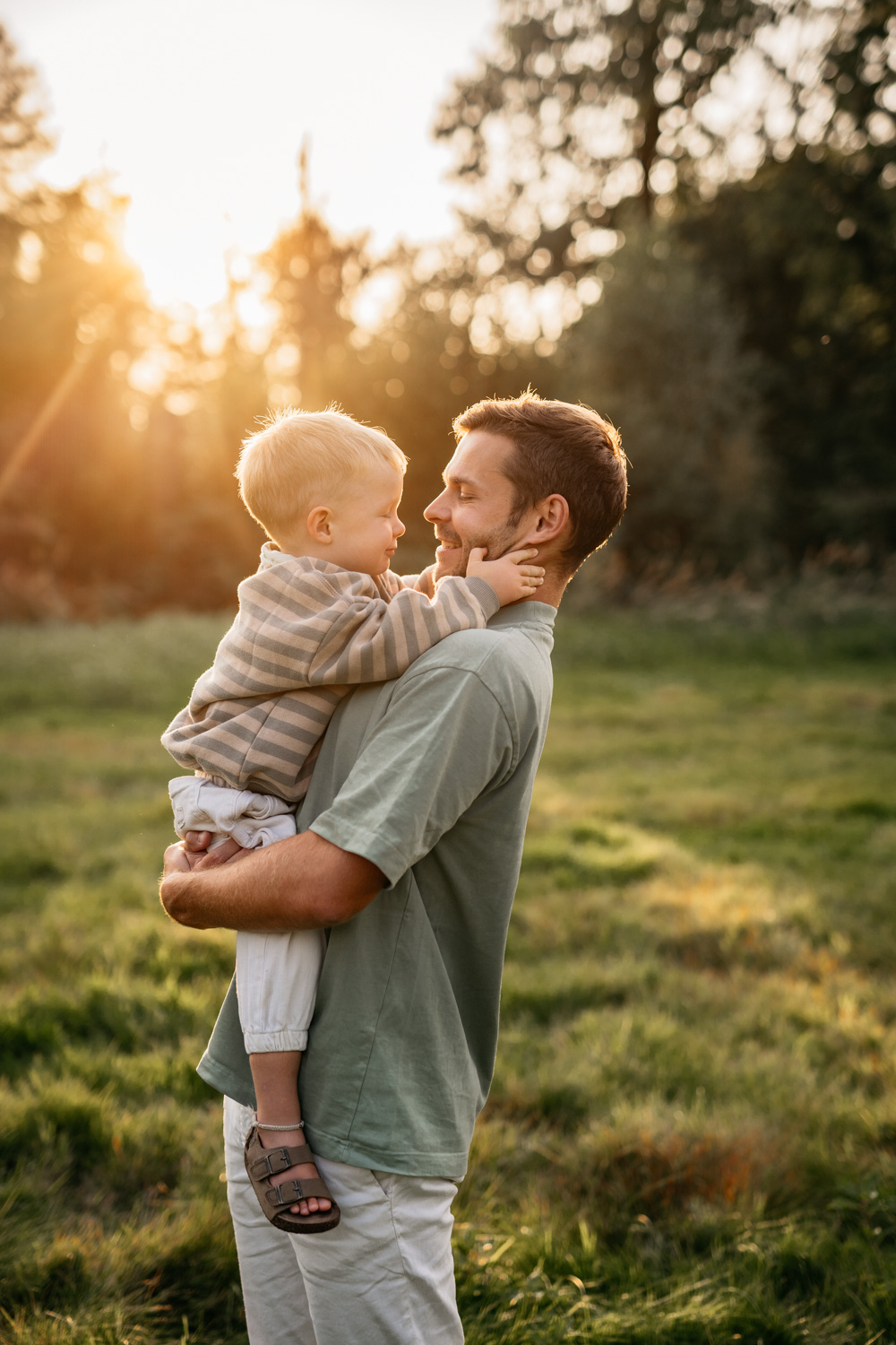 a man holding a baby in his arms