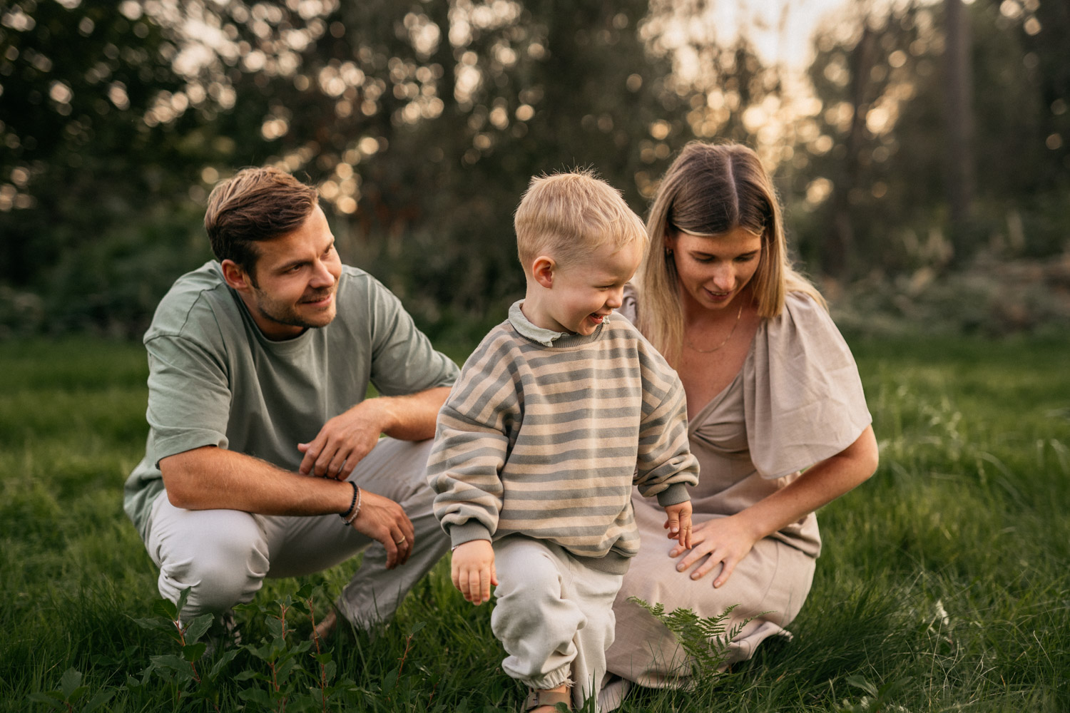 a man and woman with a child