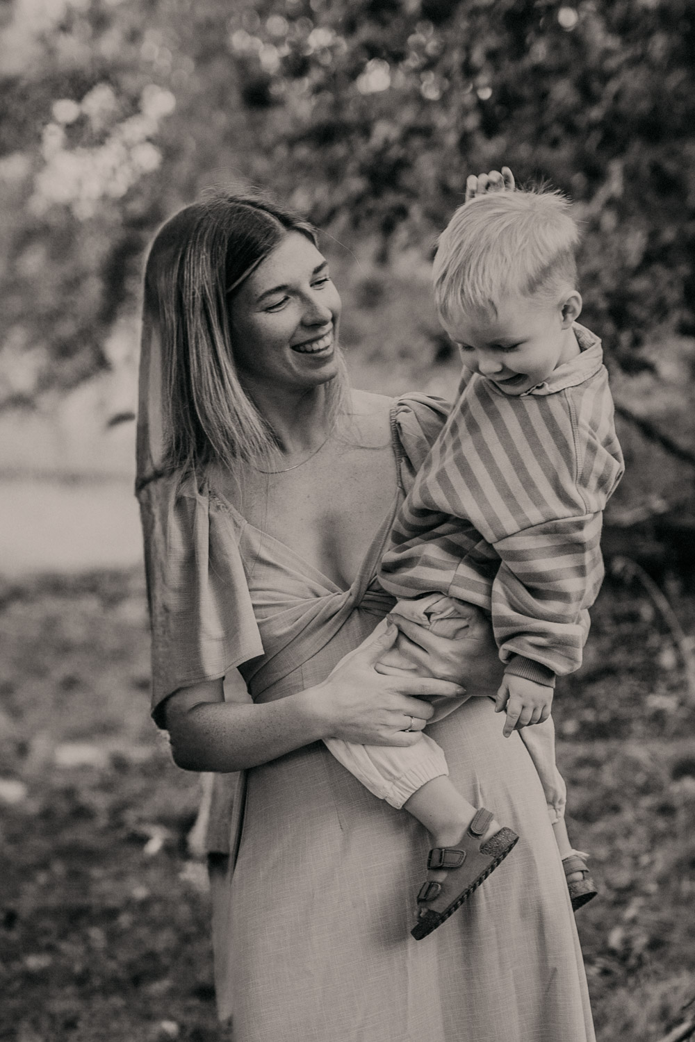 a woman holding a baby